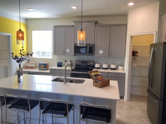 Beautiful clean kitchen with central balcony as table and a sink